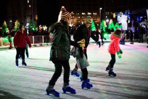 Family skating on Cleveland Foundation Ice Rink in Public Square
