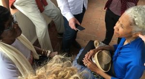 Cleveland Artist Dianne McIntyre talks with the leader of the Afro-Cuban troupe at the African Slave Museum in Cuba.
