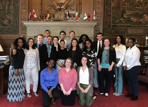 2017 Cleveland Foundation Summer Interns stand in front of fireplace in Mayor's office